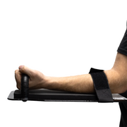 Person using a black 8" x 17" Caliber Armor Ballistic Shield with handle padded armrest & forearm strap on a white background 6