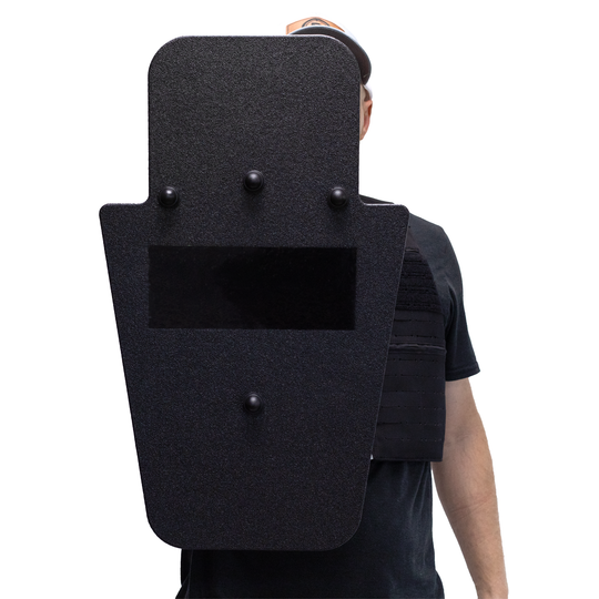 Front of black 15" x 25" Caliber Armor Rifle rated Level III+ RF2 Ballistic Shield with pivoting handle held by a man a white background 5