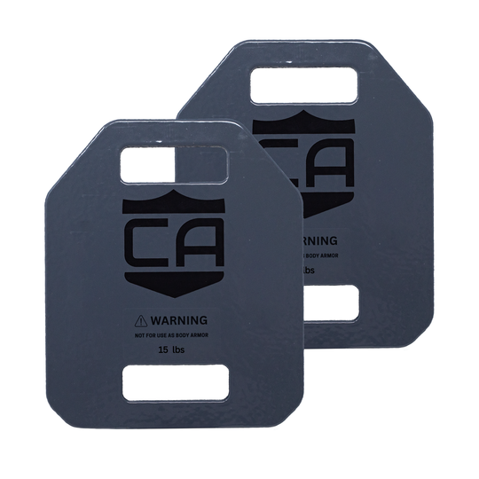 pair of grey weighted training plates weighing 15 pounds a piece 7