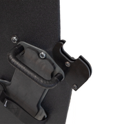 Close-up of backside of a black protective shield with a handle and gun support bracket mounted on a white background 2